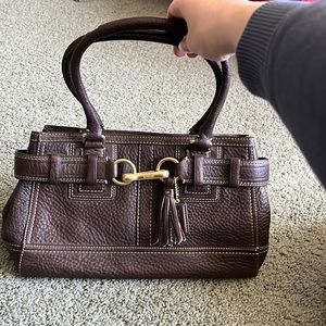 Brown leather Coach purse.